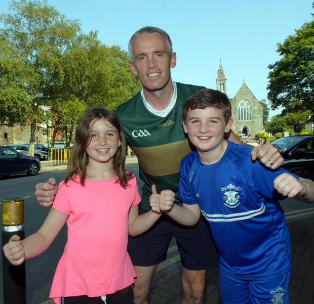 Kerry fans John Doyle, Sophie Doyle (9) and Adam Doyle (11) from Kilcummin, Killarney.